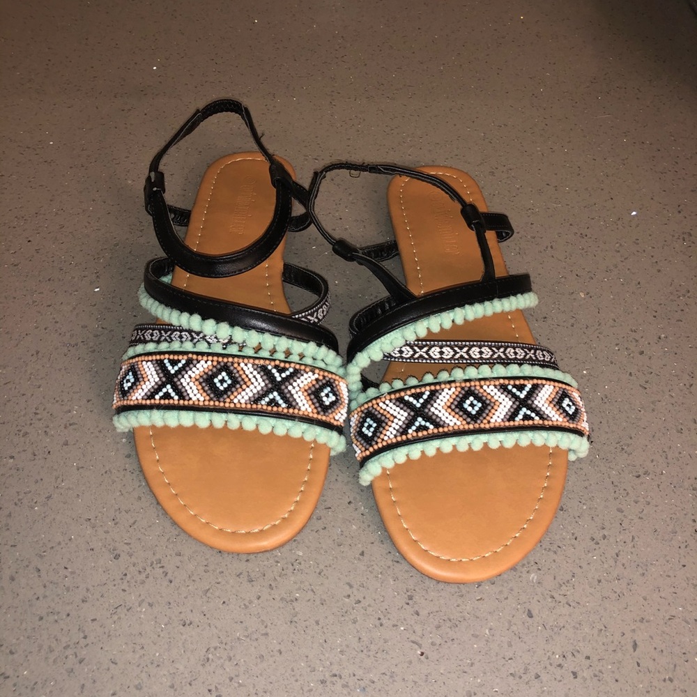 Beaded details with cute Pom Pom sandals.